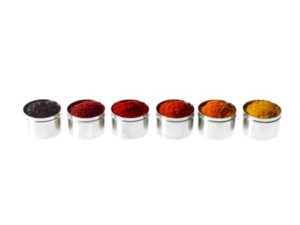 Studio shot of row of jars with spices. Photo : David Arky