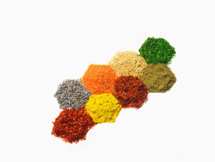 Studio shot of Piles of spice on white background. Photo : David Arky