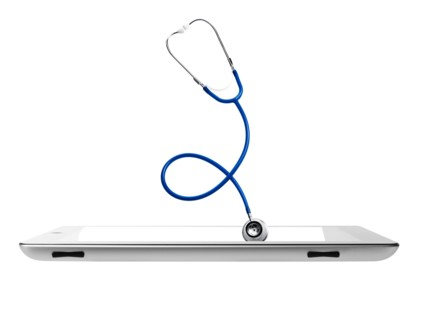 Studio shot of stethoscope coming out from digital tablet. Photo : David Arky