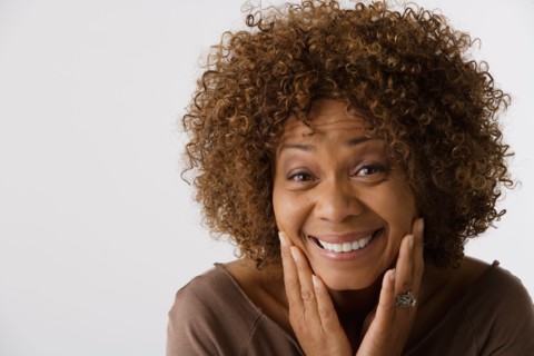 Portrait of mature woman, studio shot. Photo: Rob Lewine