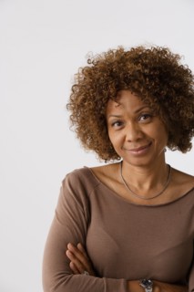 Portrait of mature woman, studio shot. Photo: Rob Lewine
