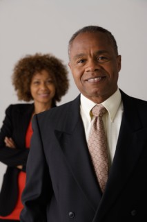 Mature business people, studio shot. Photo: Rob Lewine