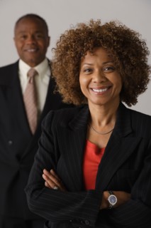 Mature business people, studio shot. Photo : Rob Lewine