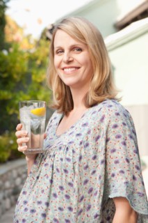 Pregnant woman enjoying non alcoholic drink. Photo : Rob Lewine