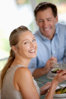 Mature couple eating meal. Photo : Rob Lewine