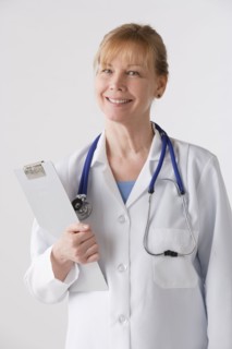 Portrait of female doctor, studio shot. Photo : Rob Lewine