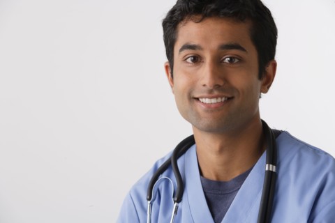 Portrait of young male nurse, studio shot. Photo : Rob Lewine
