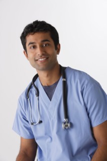 Portrait of young male nurse, studio shot. Photo : Rob Lewine