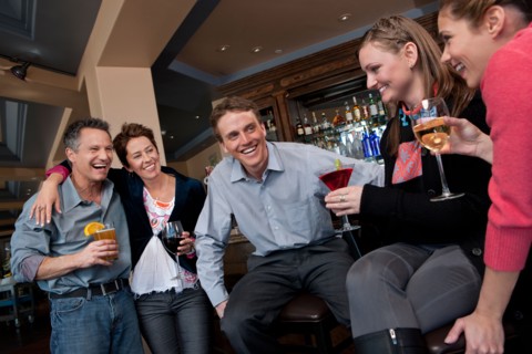 Group of people enjoying apres ski drink in bar. Photo : db2stock