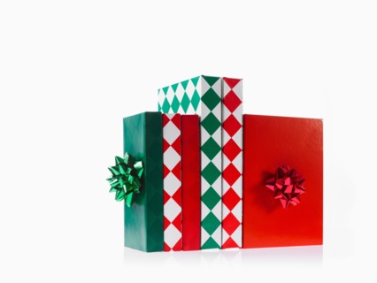 Three boxes with ribbons, studio shot. Photo : David Arky
