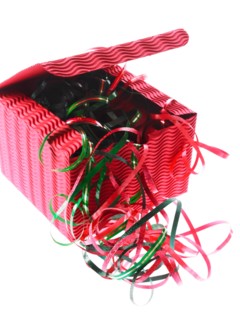 Studio shot of Red and Green Ribbon and Red Box on white background. Photo : David Arky