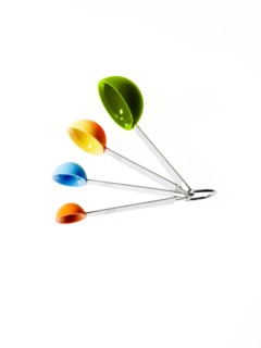 Studio shot of multicolored measuring spoons. Photo : David Arky