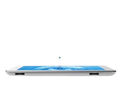 Studio shot of water splashing on digital tablet. Photo : David Arky