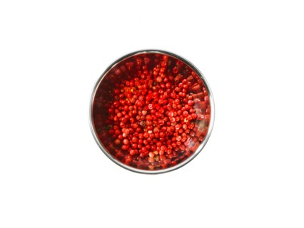 Studio shot of Red Chili Flakes in pan on white background. Photo : David Arky
