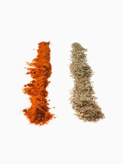 Studio shot of Red Chili Powder and Tumeric Powder on white background. Photo : David Arky