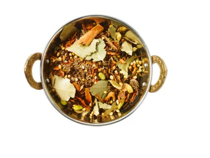 Studio shot of Indian Spices in pan on white background. Photo: David Arky