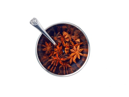 Studio shot of star anise in bowl. Photo : David Arky
