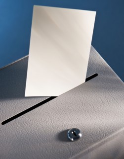 Ballot box and blank paper, studio shot. Photo : Daniel Grill