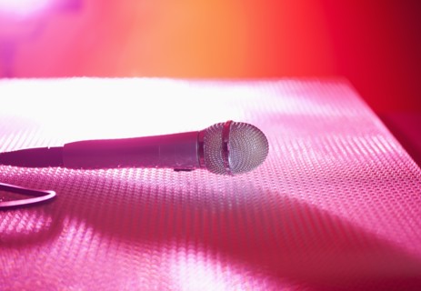 Close up of microphone lying on stage. Photo : Daniel Grill