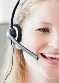 Young woman wearing headset. Photo : Jamie Grill