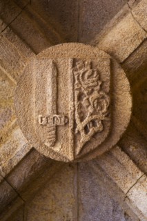 Greece, Rhodes, Stone shield on medieval fortified wall.