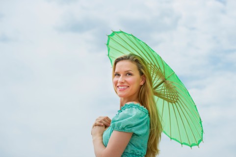 Woman holding parasol.