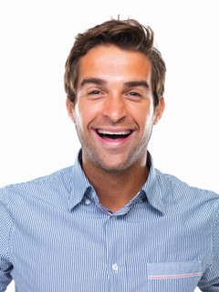 Studio portrait of cheerful business man smiling. Photo : momentimages
