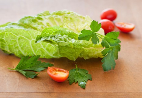 Fresh salad on cutting board.