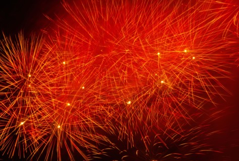 Fireworks explosion against night sky.