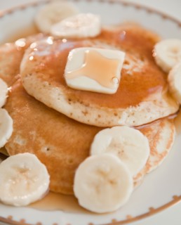 Close up of pancakes with bananas. Photo: Jamie Grill