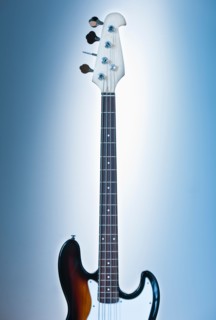 Close up of electric guitar on blue backgrounds. Photo : Daniel Grill