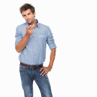 Studio shot of young thoughtful man gesturing. Photo: momentimages