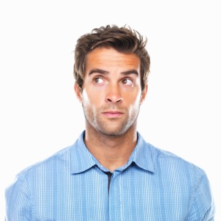 Close-up of business man looking away. Photo : momentimages