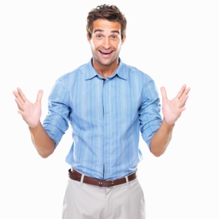 Portrait of excited business man standing. Photo : momentimages