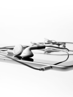 Studio shot of digital tablet and earphones. Photo : David Arky