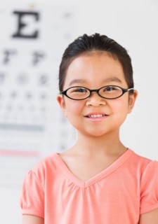 Girl (6-7) at eye exam.