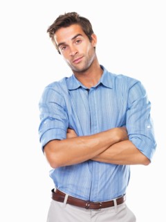 Studio portrait of smart young business man smiling. Photo : momentimages