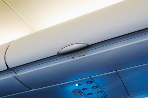 Overhead storage compartment in airplane.