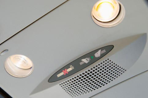 Warning signs in airplane cabin.