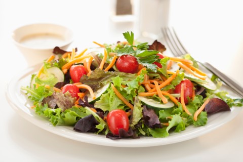 Fresh salad on plate.