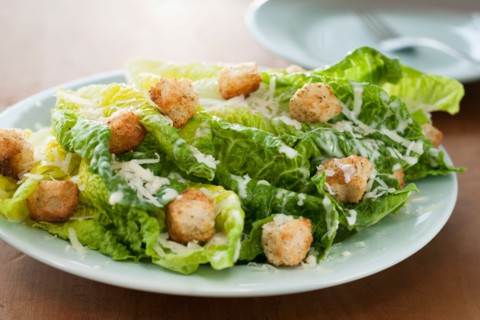 Fresh caesar salad on plate.