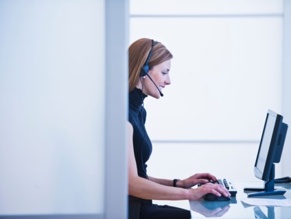 Young woman working in office. Photo: Daniel Grill