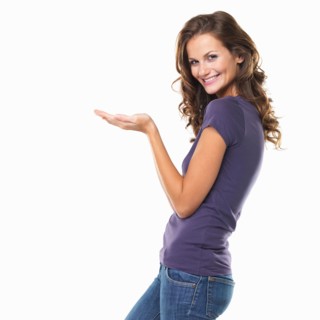 Studio portrait of attractive young woman gesturing and smiling. Photo: momentimages