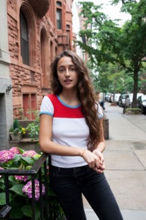 USA, New York, New York City, Portrait of young woman standing on street. Photo : Winslow
