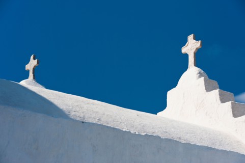 Greece, Cyclades Islands, Mykonos, Crosses on church roof.