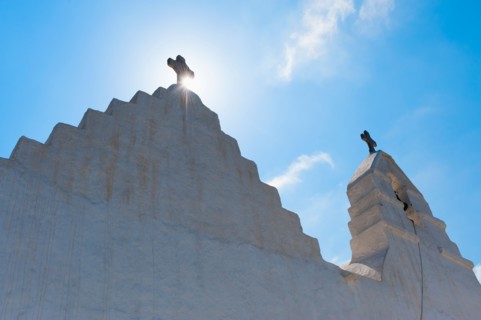 Greece, Cyclades Islands, Mykonos, Church bell tower with cross.