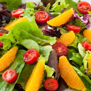 Fresh salad on plate.