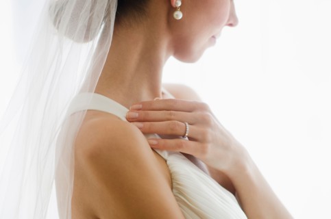 Bride wearing veil.