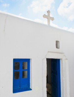 Greece, Cyclades Islands, Mykonos, Church with cross on roof.