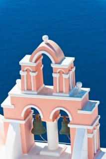 Greece, Cyclades Islands, Santorini, Oia, Church bell tower by sea.